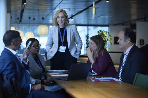 TEG CEO Jennifer Morrell speaking with international election colleagues in Stockholm, Sweden
